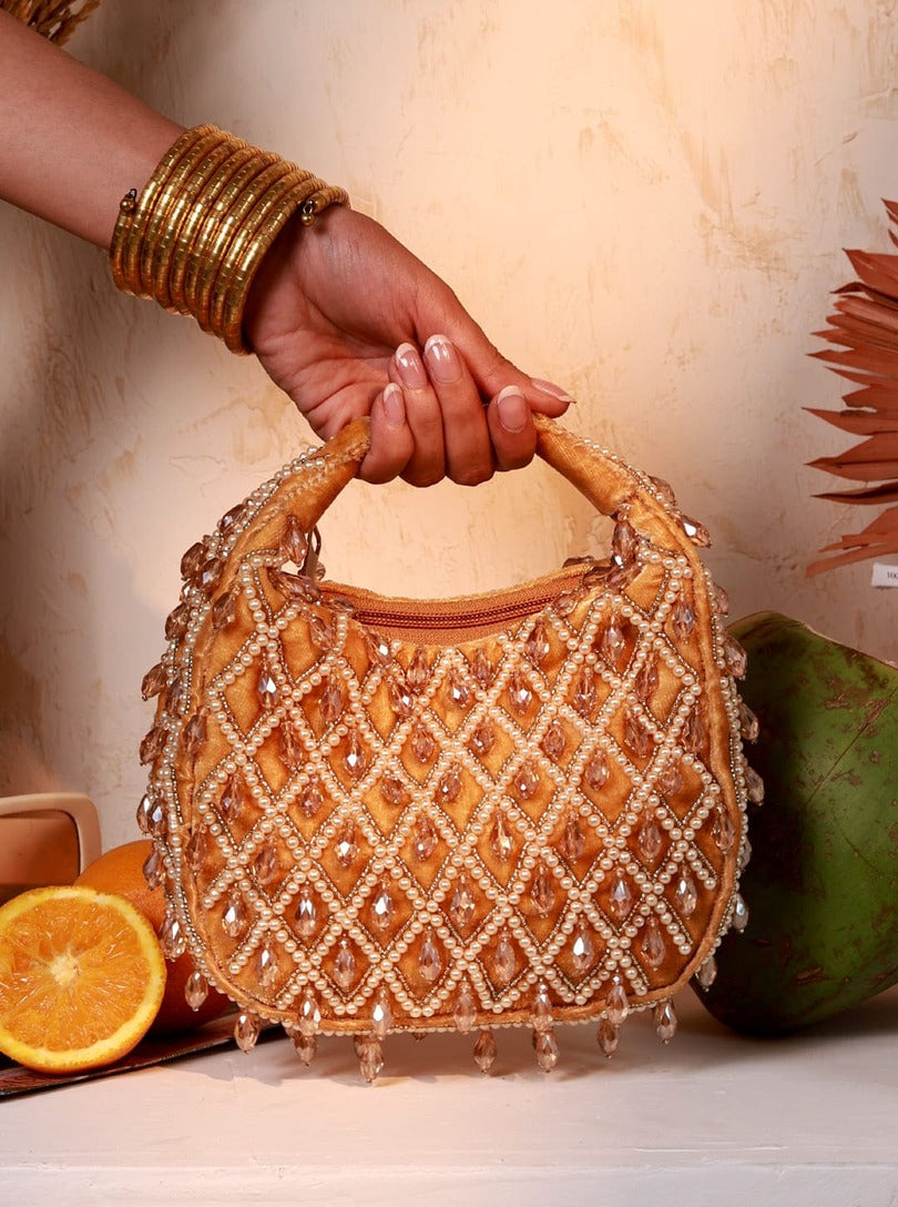 Diya Pearl Half Moon Batua Bag by The Tan Clan featuring pearl embellishments and a sleek half-moon shape for elegant style.