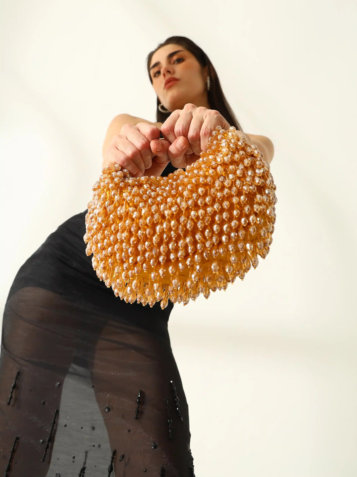 Gold half moon bag by The Tan Clan, Jia Batua Bag with stylish design and compact shape, perfect for casual or evening wear.