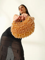 Gold half moon bag by The Tan Clan, Jia Batua Bag with stylish design and compact shape, perfect for casual or evening wear.