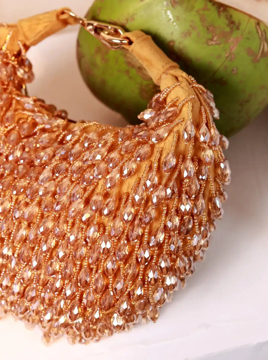 Golden Jia Half Moon Batua Bag by The Tan Clan with elegant curved design and stylish gold finish.