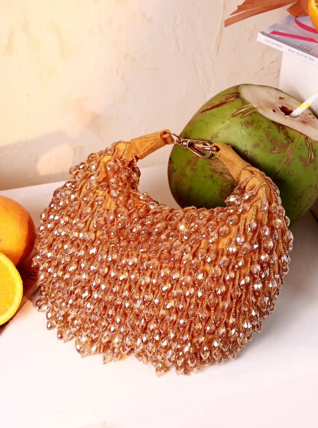 Jia Gold Half Moon Batua Bag by The Tan Clan featuring a shiny gold finish and elegant half-moon shape.