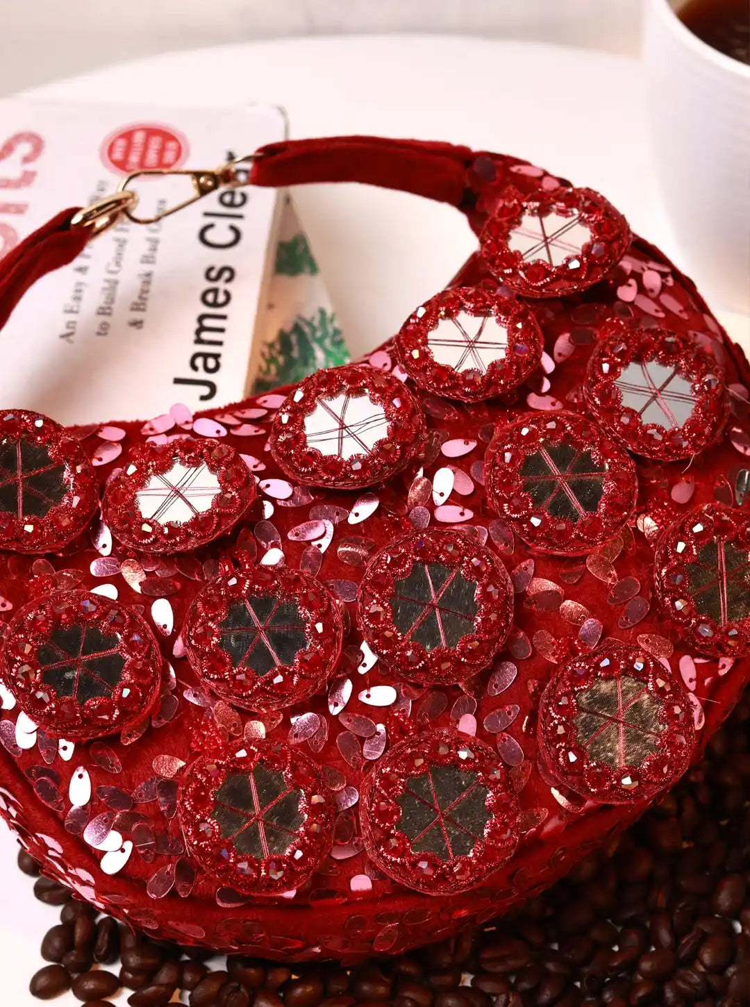 Red half-moon Batua bag with mirror detail from The Tan Clan, featuring a stylish and compact design for everyday use.