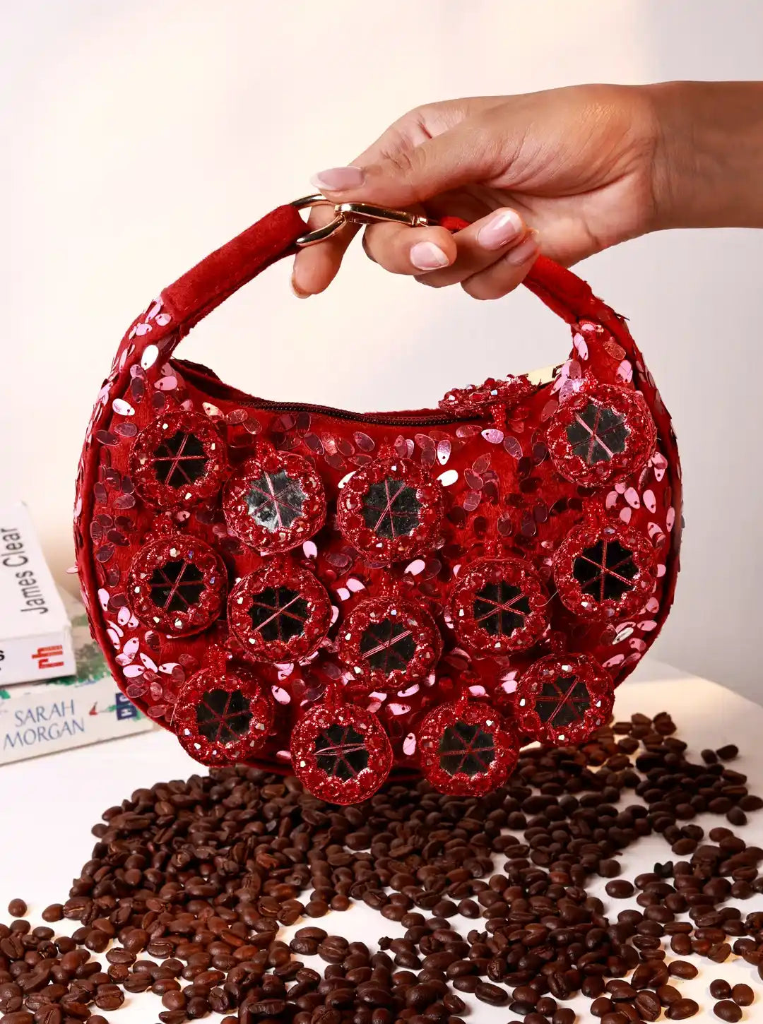 Red half moon Batua bag with mirror detail from The Tan Clan Kim Mirror collection, featuring a stylish and compact design.