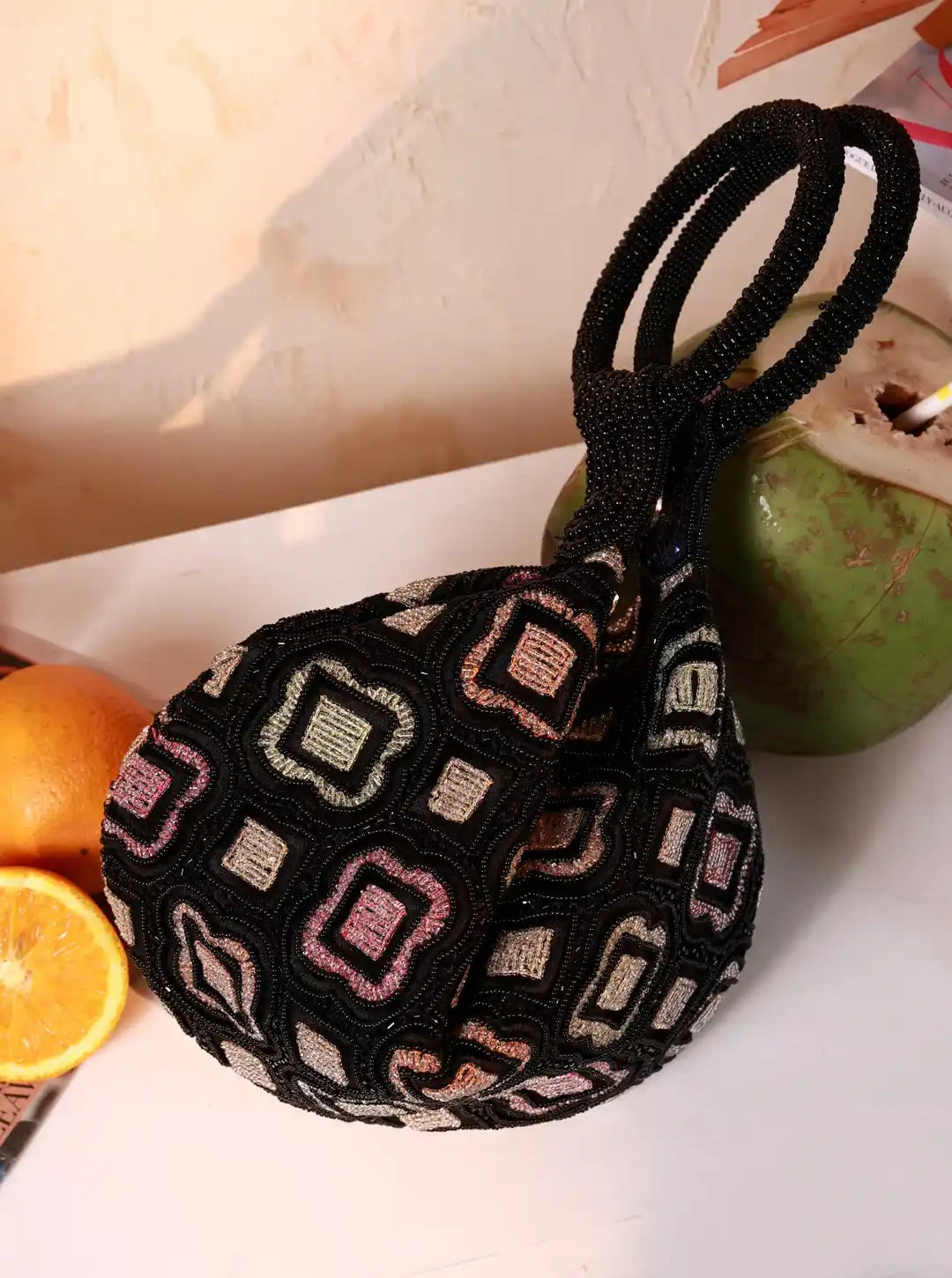 Luna Black Half Moon Bag by The Tan Clan, batua style bag with sleek black leather and half-moon shape, front view.