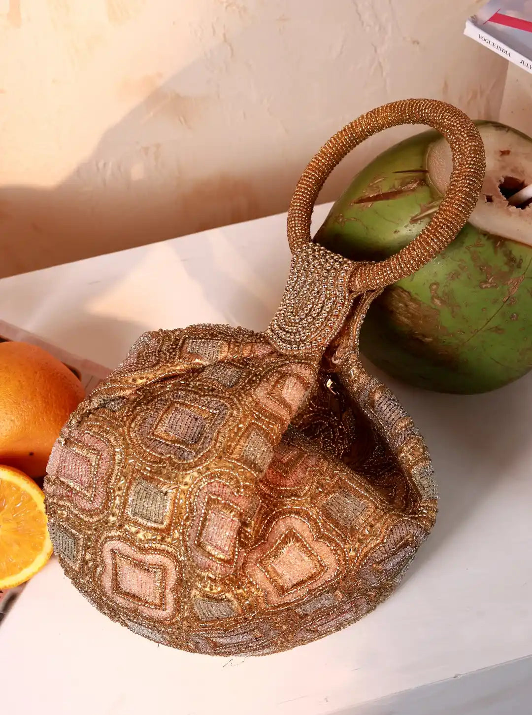 Luna Gold Half Moon Batua Bag by The Tan Clan, featuring a shiny gold finish and elegant half-moon shape with adjustable strap.