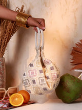Luna White Half Moon Batua Bag by The Tan Clan featuring a sleek white leather design and curved half-moon shape.