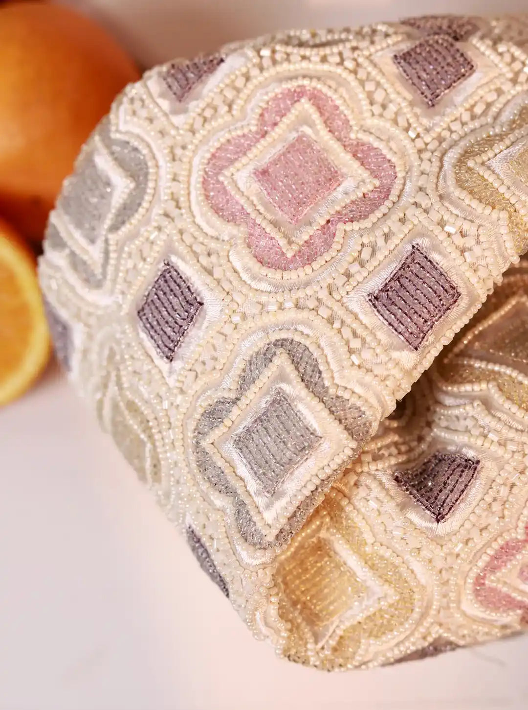 Luna White Half Moon Batua Bag by The Tan Clan featuring a sleek white leather design and curved half-moon shape.