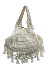 Nora Tasselled Half Moon Batua Bag by The Tan Clan featuring tassels and a half moon shape in brown leather.