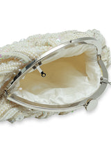 Nora Tasselled Half Moon Batua Bag by The Tan Clan featuring tassels and a stylish half moon shape.