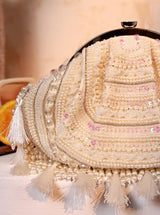 Nora Tasselled Half Moon Bag from The Tan Clan, stylish batua bag with tassels and half moon shape, made of leather.