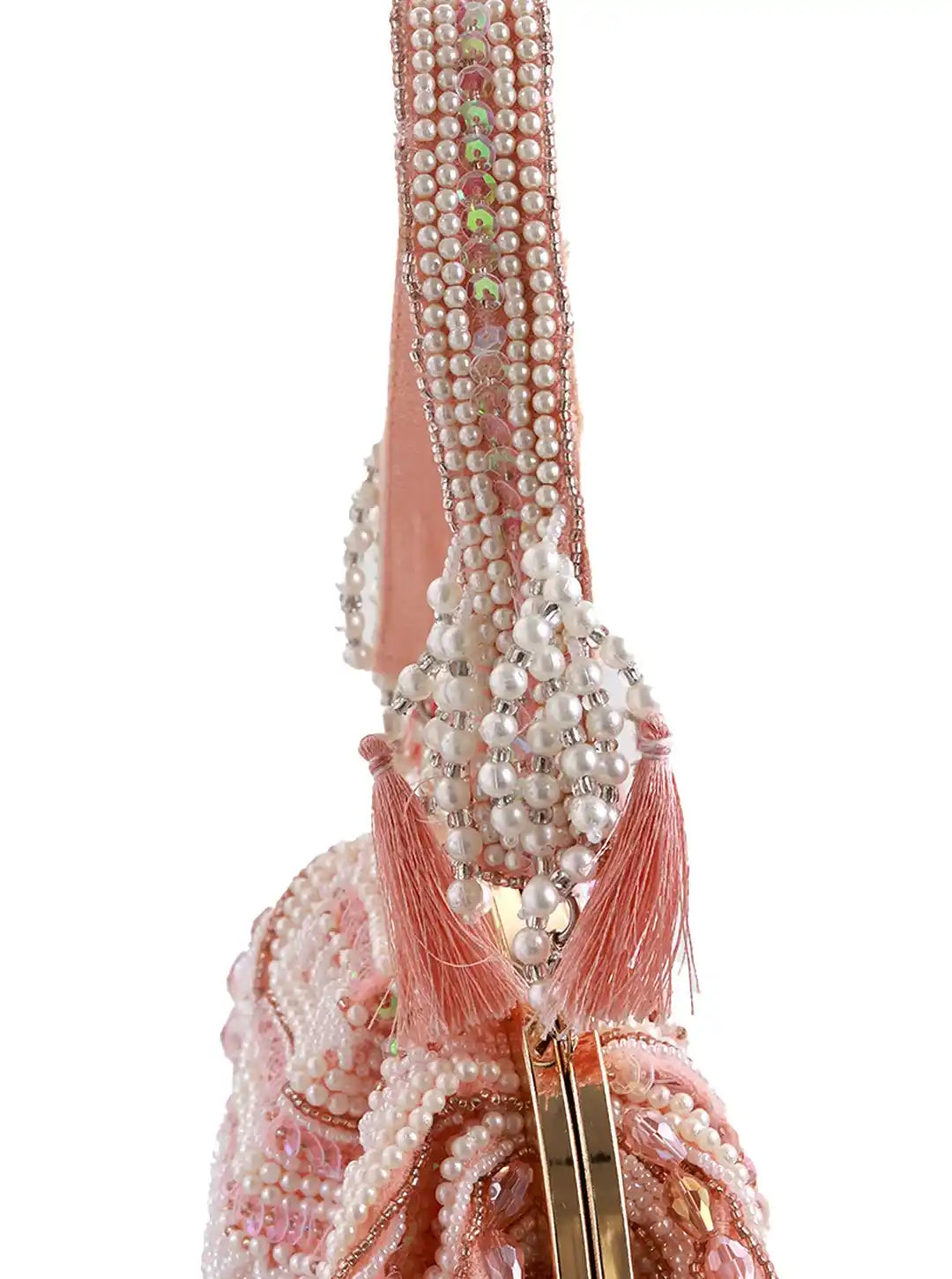 Tan Tan Clan Nora tasselled half moon Batua bag with leather strap and decorative tassels, stylish and compact for everyday use.
