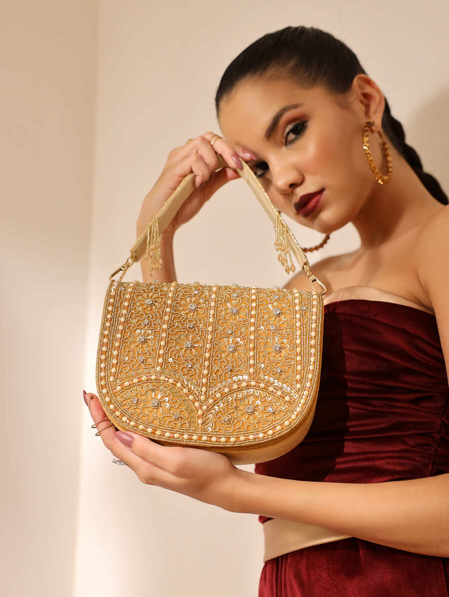 Beige Kavya Gold Flap Over Bag with Handle by The Tan Clan, featuring a stylish flap closure and top handle.