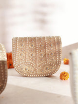 Beige Kavya gold flap-over bag with handle from The Tan Clan, featuring a stylish design and spacious interior.