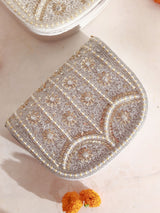 Kavya gold flap-over bag by The Tan Clan featuring beige color, handle, and stylish design for versatile carry.