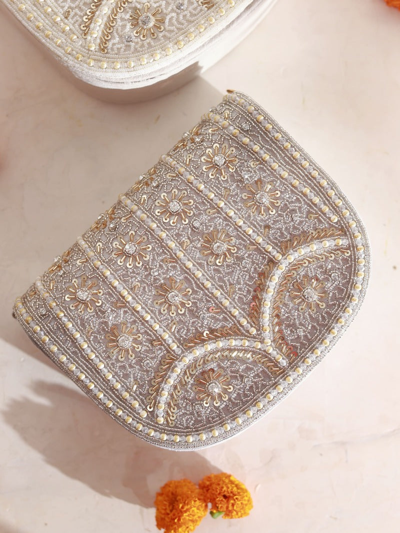 Kavya Gold flap-over bag with handle from The Tan Clan, featuring a stylish gold finish and elegant design.