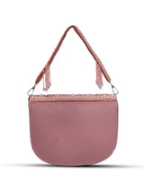 Pink Kavya flap-over bag with handle by The Tan Clan, featuring a stylish design and beige accents on a neutral background.