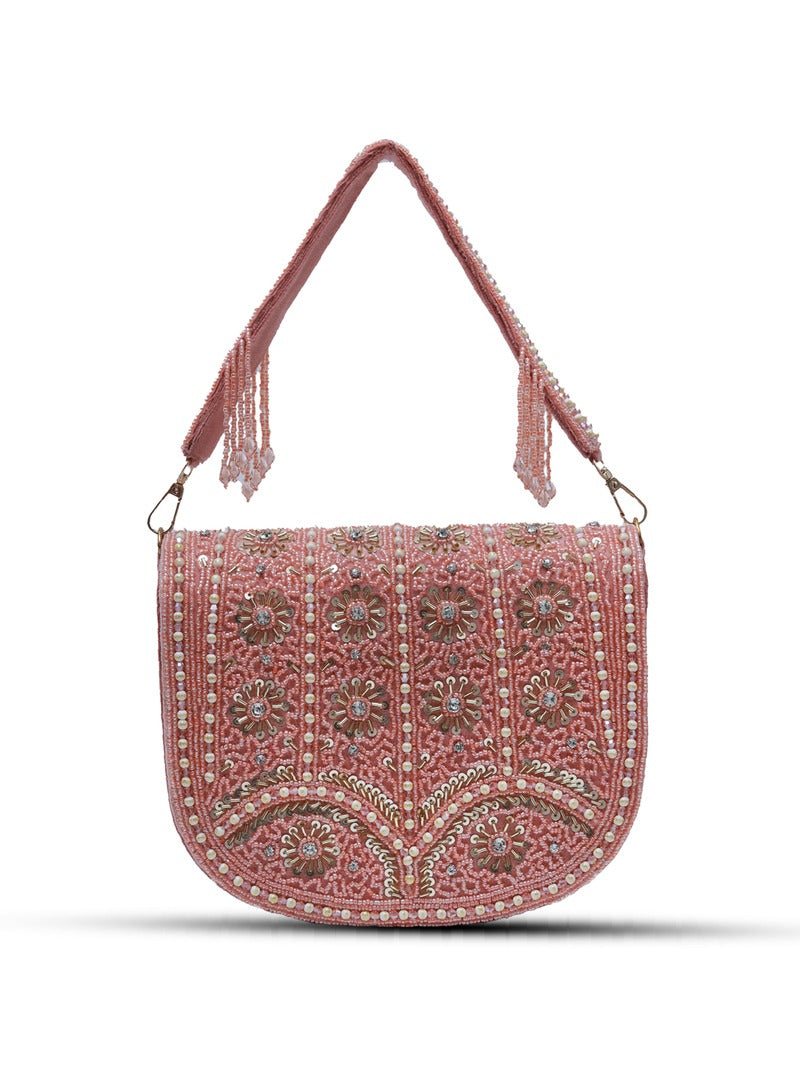 Pink flap-over bag with handle from The Tan Clan, featuring beige accents and a stylish design.