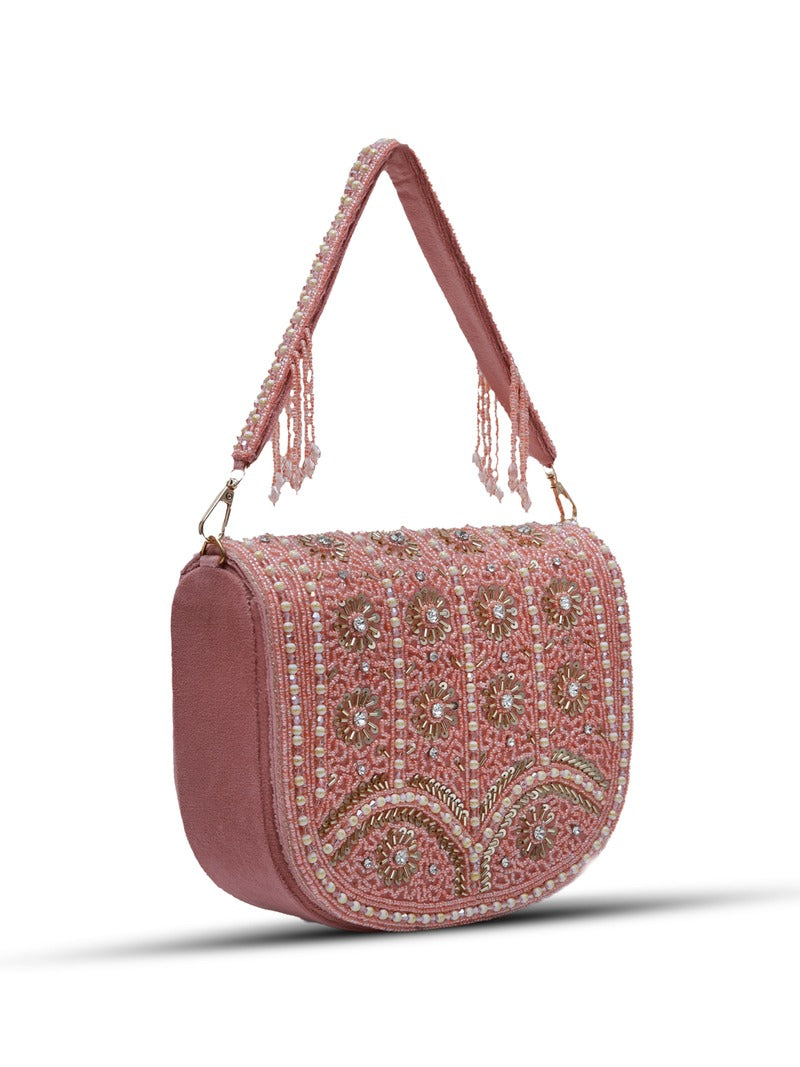 Pink Kavya flap-over bag by The Tan Clan with handle, featuring a stylish design and beige accents.