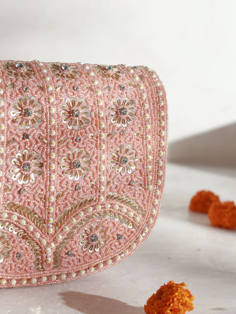Kavya pink flap-over bag with handle by The Tan Clan, featuring a stylish design and beige color.