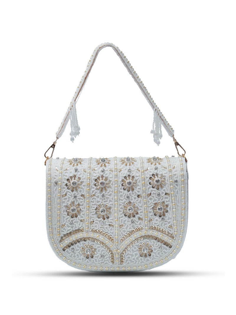 White Kavya flap-over bag with handle by The Tan Clan, featuring a sleek design and spacious interior.