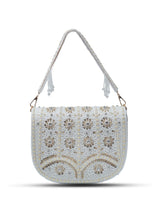White Kavya flap-over bag with handle by The Tan Clan, featuring a sleek design and spacious interior.