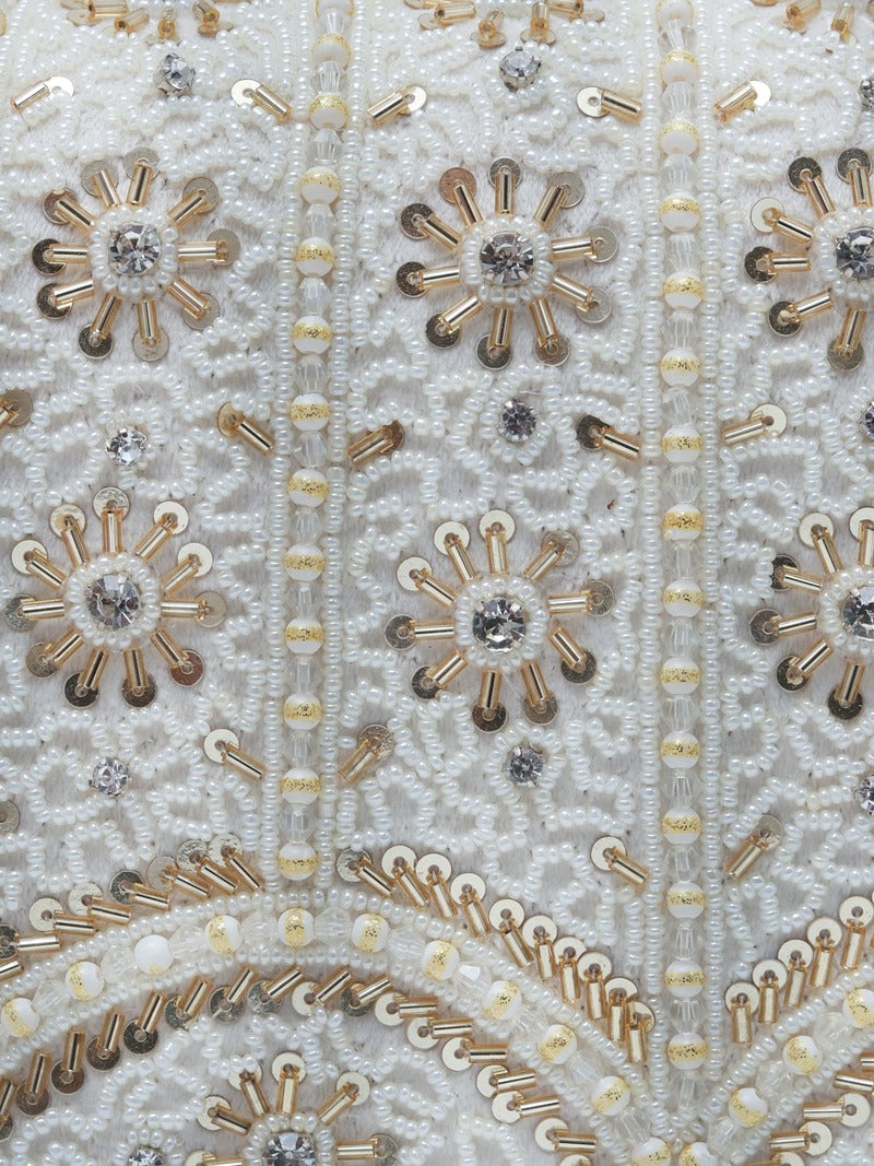 Kavya White Flap Over Bag with Handle by The Tan Clan, showcasing a beige and white design with a flap closure and top handle.