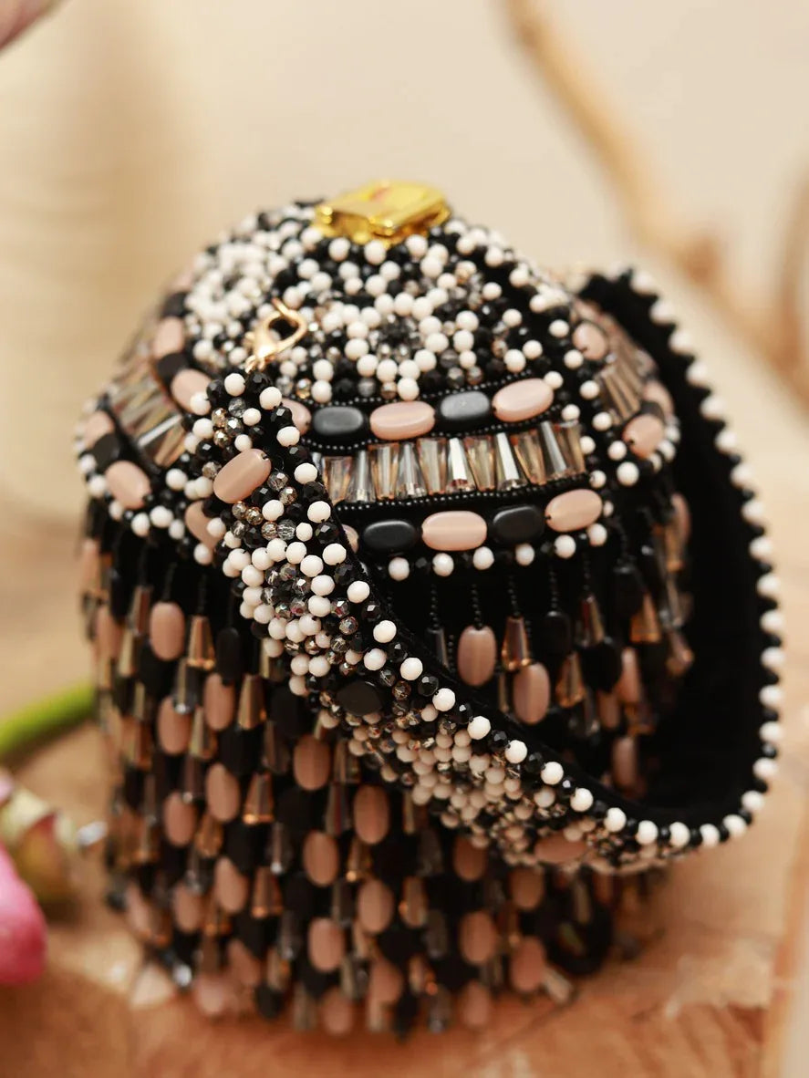 Black Bella round embellished bag with handle from The Tan Clan, featuring decorative details and a stylish design.