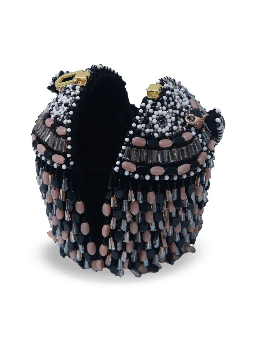 Black Bella round embellished bag with handle by The Tan Clan, featuring decorative accents and a comfortable carrying handle.