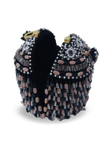 Black Bella round embellished bag with handle by The Tan Clan, featuring decorative accents and a comfortable carrying handle.