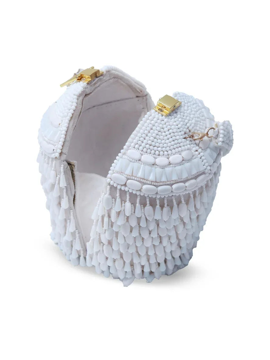 Bella White round embellished bag with handle by The Tan Clan, featuring decorative accents and a sleek, stylish design.