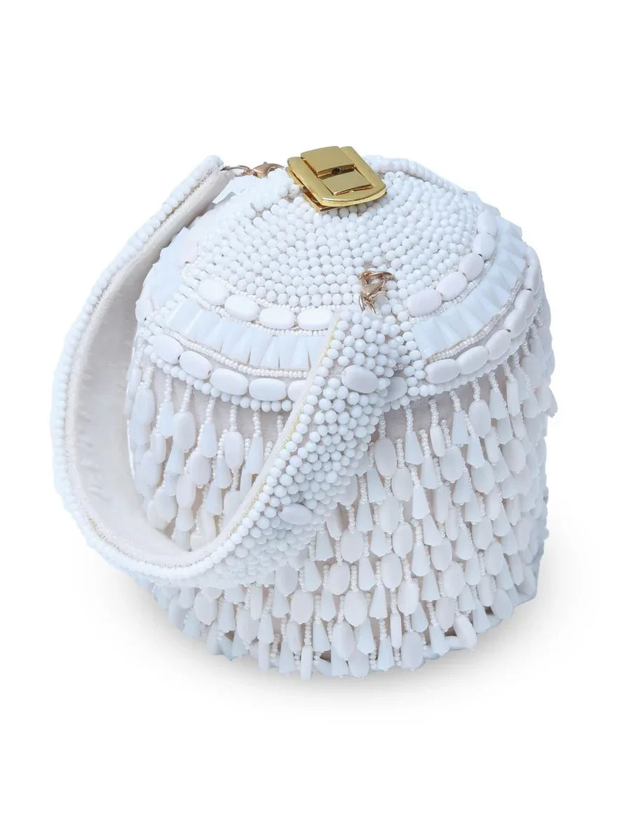Bella White round embellished bag with handle by The Tan Clan, featuring decorative details on smooth surface.
