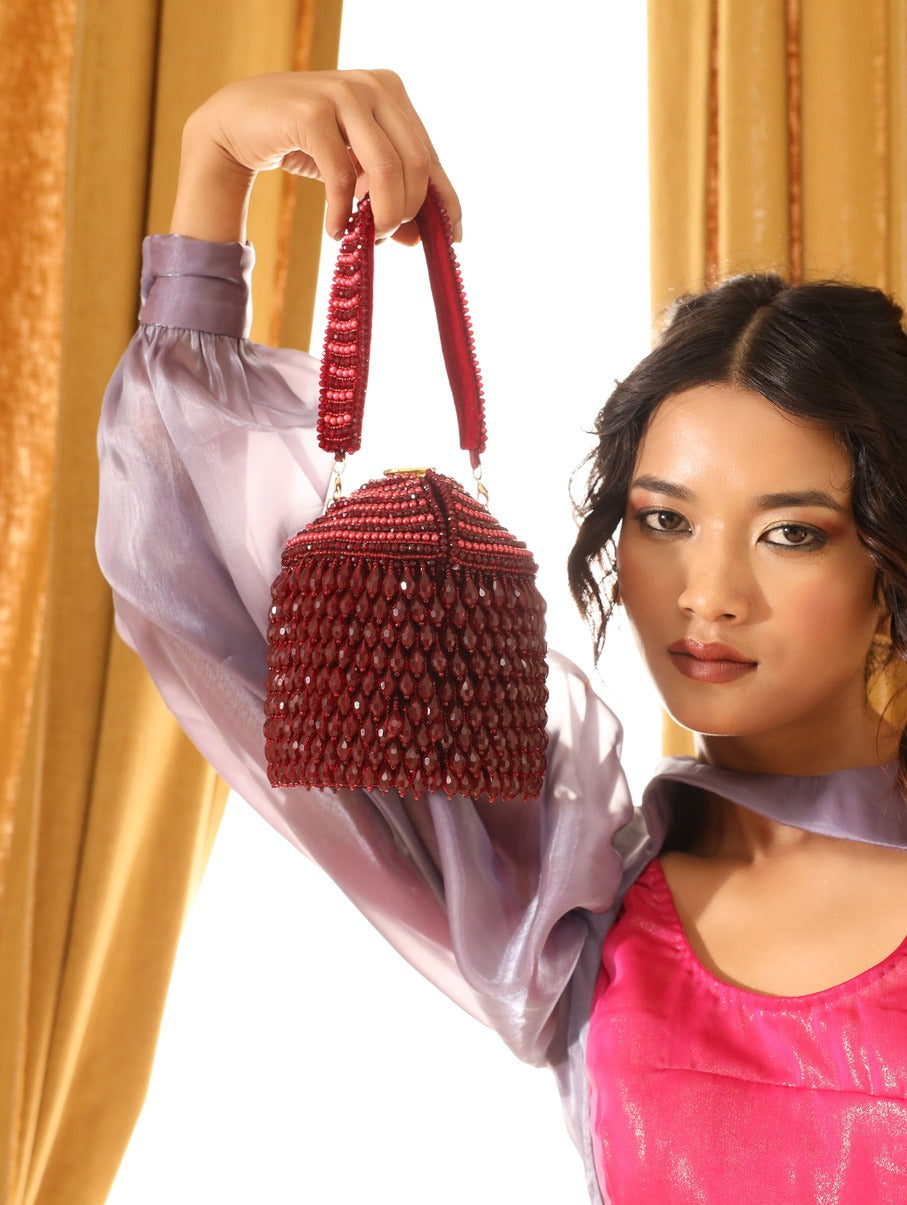 Black Emma round embellished bag with handle from The Tan Clan, featuring decorative details and a sleek, stylish design.