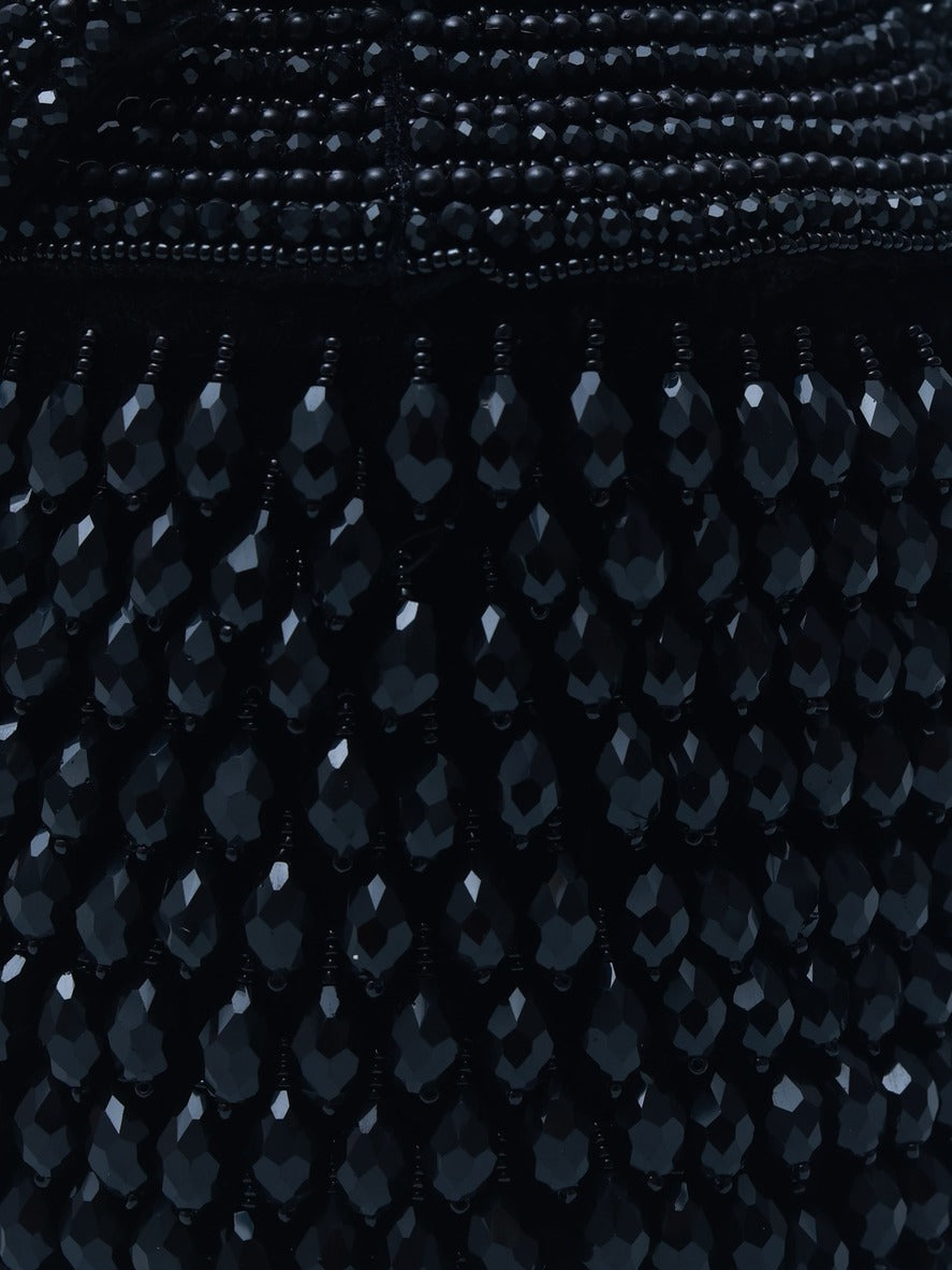 Black Emma round embellished bag with handle from The Tan Clan, featuring decorative details and a stylish, compact design.