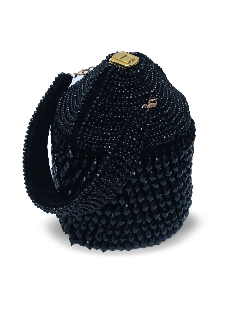 Black Emma round embellished bag with handle by The Tan Clan, featuring decorative accents and a stylish design.