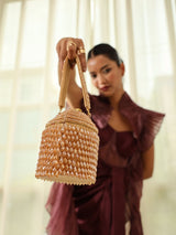 Black Emma round embellished bag with handle by The Tan Clan, featuring decorative details and a stylish design.