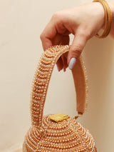 Black Emma Round Embellished Bag with Handle by The Tan Clan, featuring decorative embellishments and a sturdy handle.