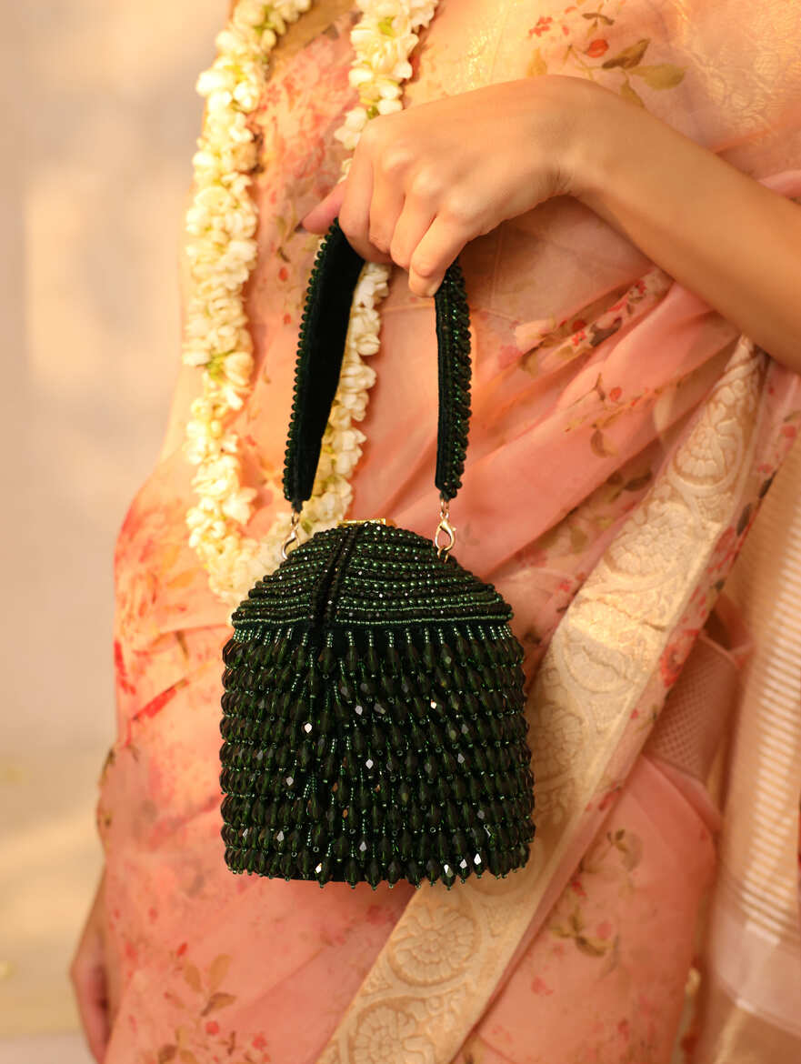 Emma round embellished bag with handle by The Tan Clan, featuring decorative accents and a stylish design.