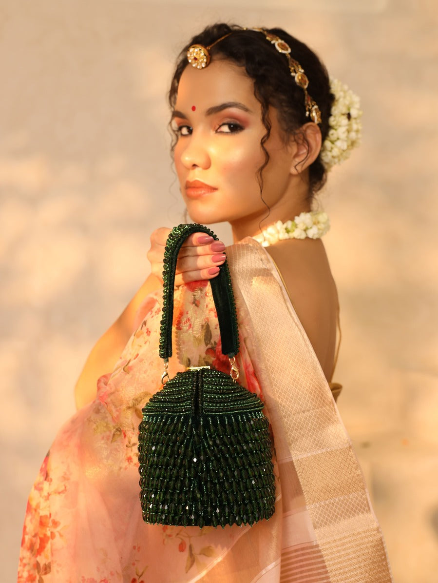 Emma round embellished bag with handle by The Tan Clan, featuring decorative details and a sleek, stylish design.