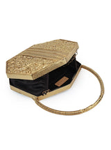 Alira brass clutch with handle by The Tan Clan, featuring a sleek metallic design and a convenient carrying handle.
