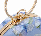 Blue embroidered clutch purse with floral design from The Tan Clan Bloom collection, stylish accessory for evening outings.