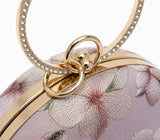 Bloom Mauve embroidered clutch by The Tan Clan, showcasing intricate embroidery and elegant design for stylish occasions.