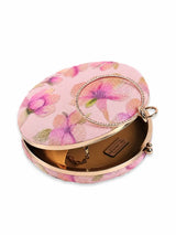 Pink embroidered clutch bag by The Tan Clan with floral embroidery and a sleek design for elegant occasions.
