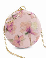 Pink embroidered clutch bag from The Tan Clan with floral embroidery, stylish accessory for evening or special occasions.