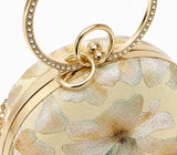 Yellow embroidered clutch bag from The Tan Clan with floral embroidery, designed as a stylish accessory for special occasions.