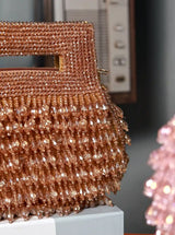 Gold pearls box clutch by The Tan Clan featuring a compact design and elegant pearl embellishments.