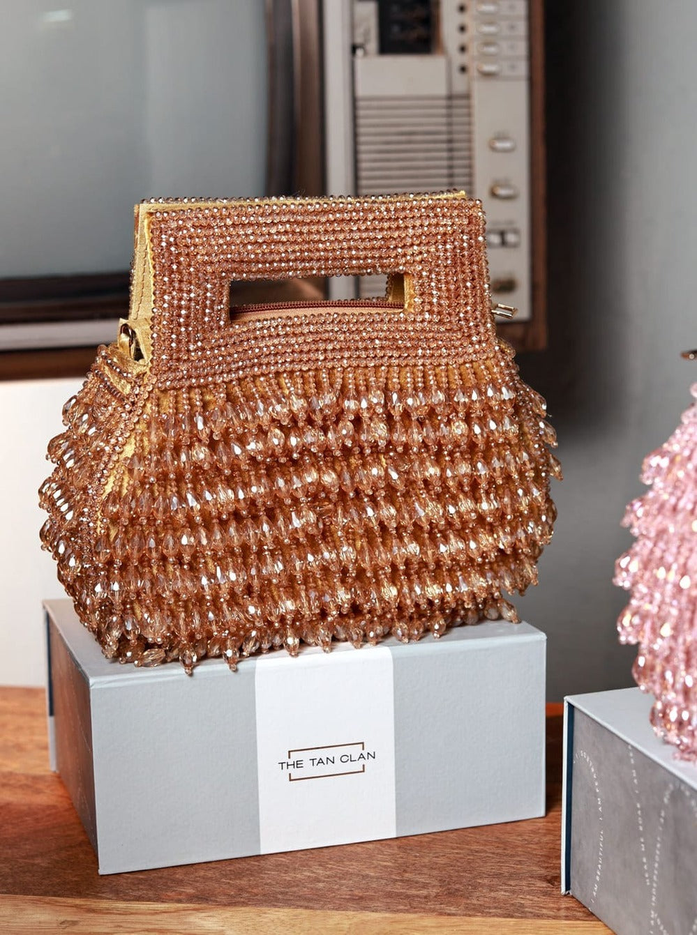 Cindy Gold Pearls Box Clutch by The Tan Clan featuring a rectangular shape with pearl embellishments and a gold finish.