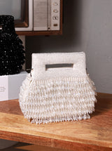 White pearl-embellished box clutch by The Tan Clan, elegant evening accessory with a sleek design and compact size.