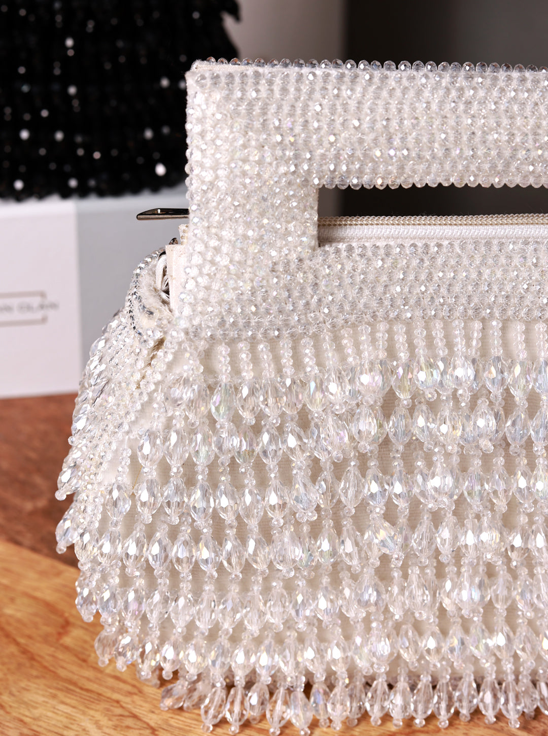 Cindy White Pearls Box Clutch by The Tan Clan featuring a pearl-embellished rectangular design with a sleek clasp closure.