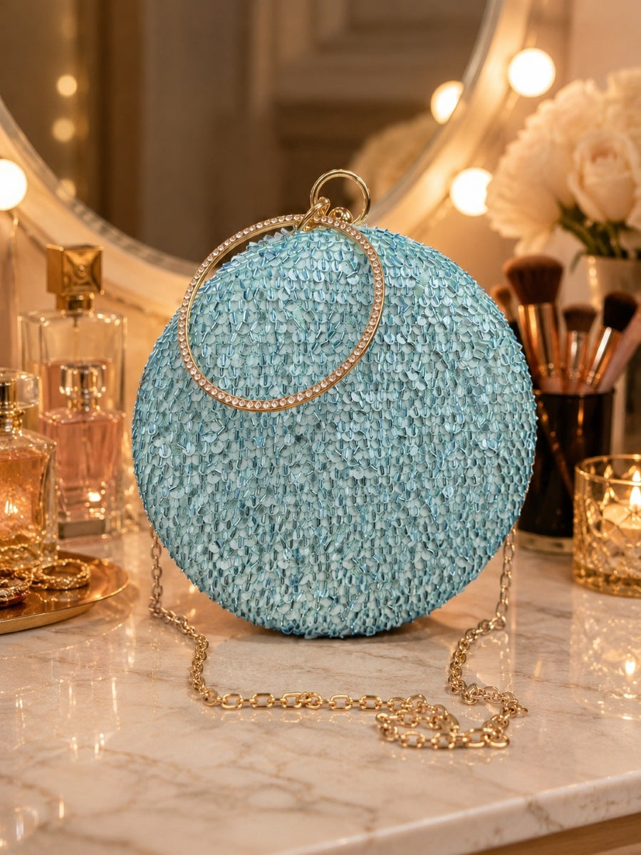 Dazzle Blue Sequined Round Clutch by The Tan Clan with sparkling sequins and a sleek round shape, perfect for evening events.
