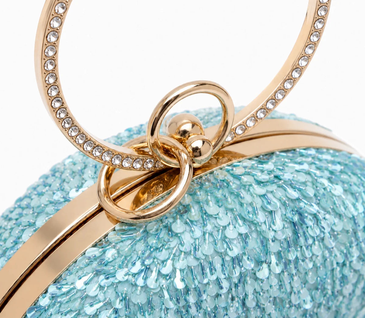Dazzle Blue sequined round clutch bag by The Tan Clan with shimmering sequins and a sleek, elegant design.